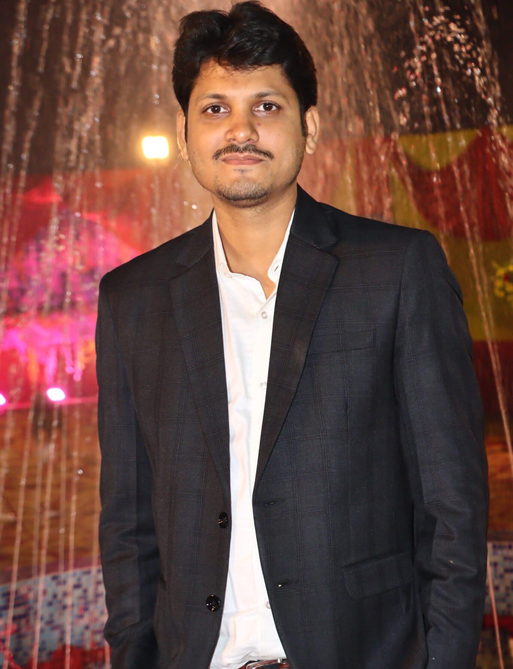 Client testimonial photo of Mr. Indranil Jha, event organizer, sharing positive feedback on PlainMark Solutions design, strategy, and digital growth support